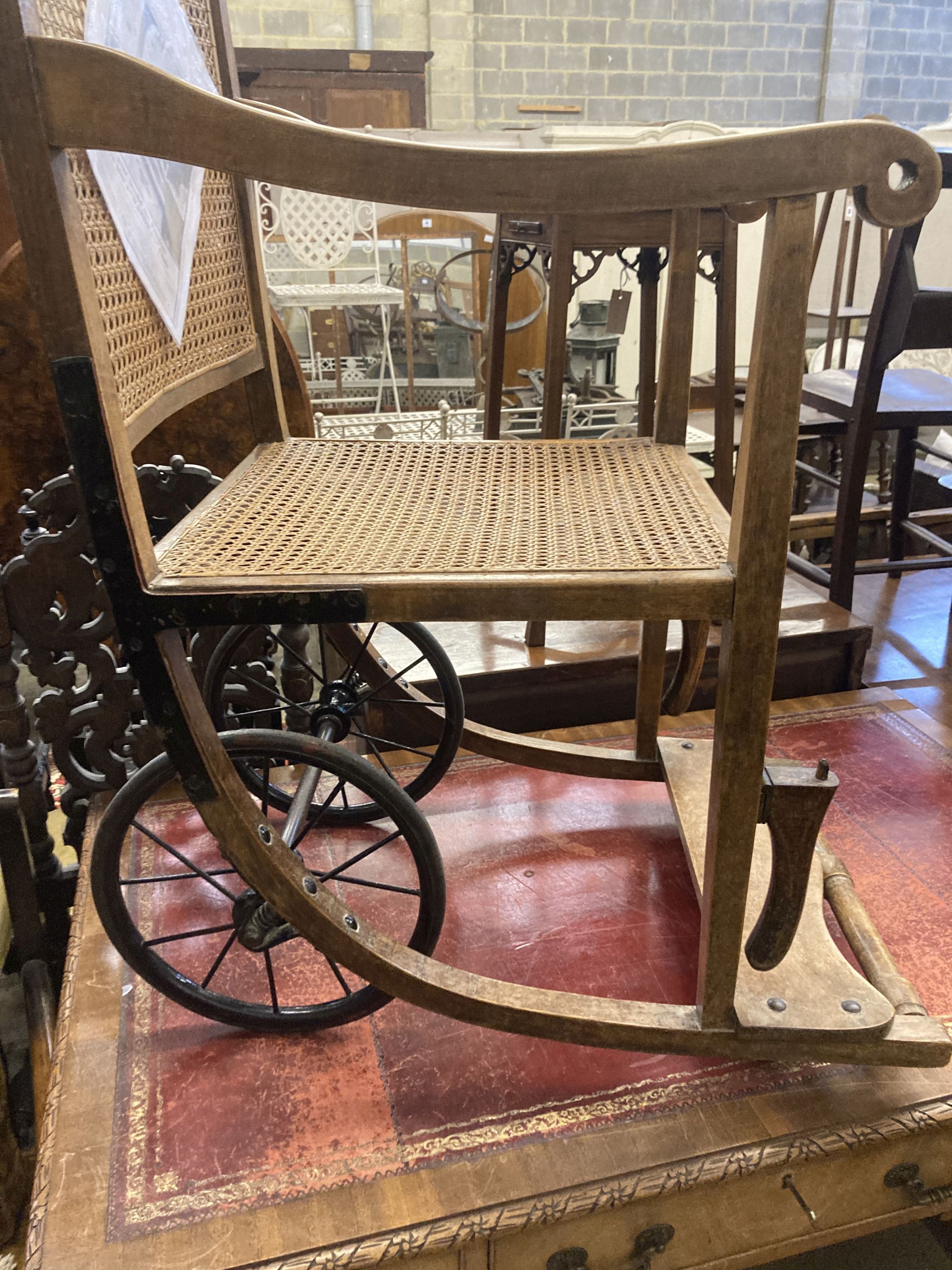 An early 20th century Wardway caned beech invalids chair, width 50cm, depth 80cm, height 118cm